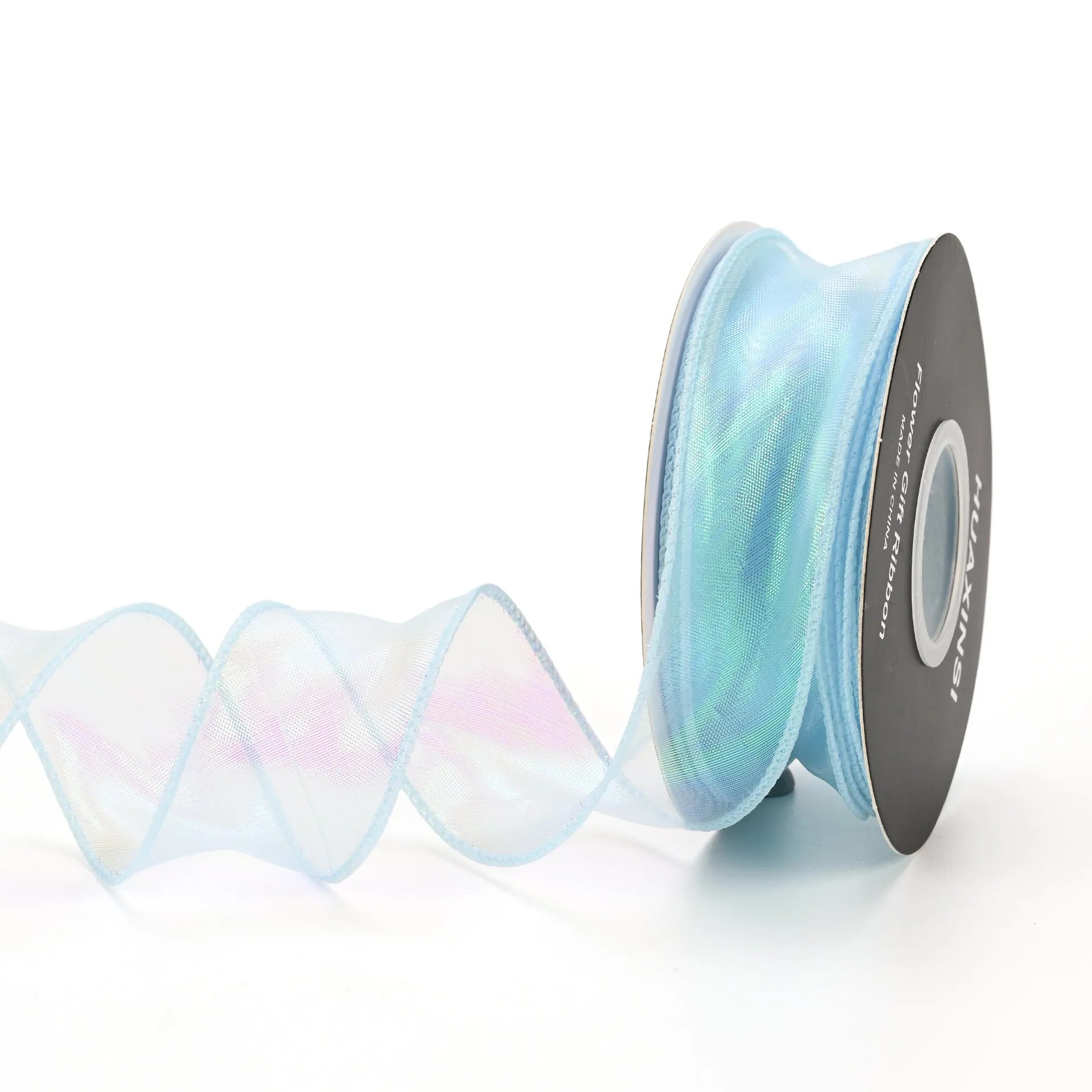 Roll of colourful wave patterned fishtail yarn decorative ribbon in mesh material, 4cm wide.