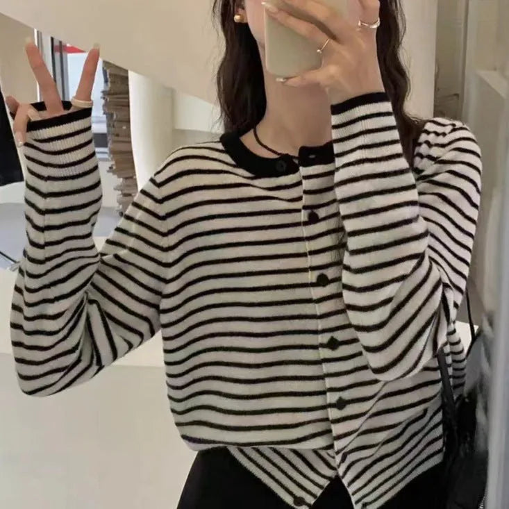 Dark grey and white striped slim fit cardigan coat for women with long sleeves.