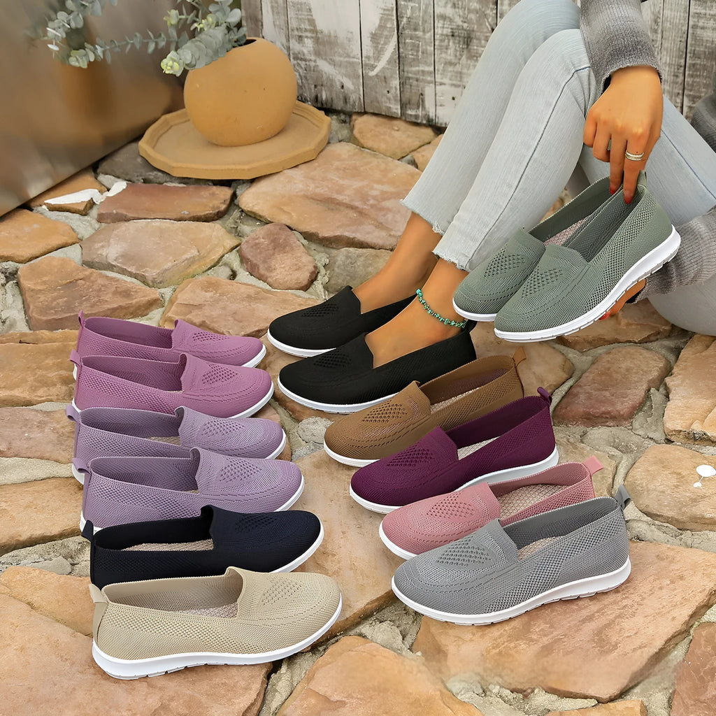 Women's plus size beige slip-on loafers with heart pattern and mesh lining.