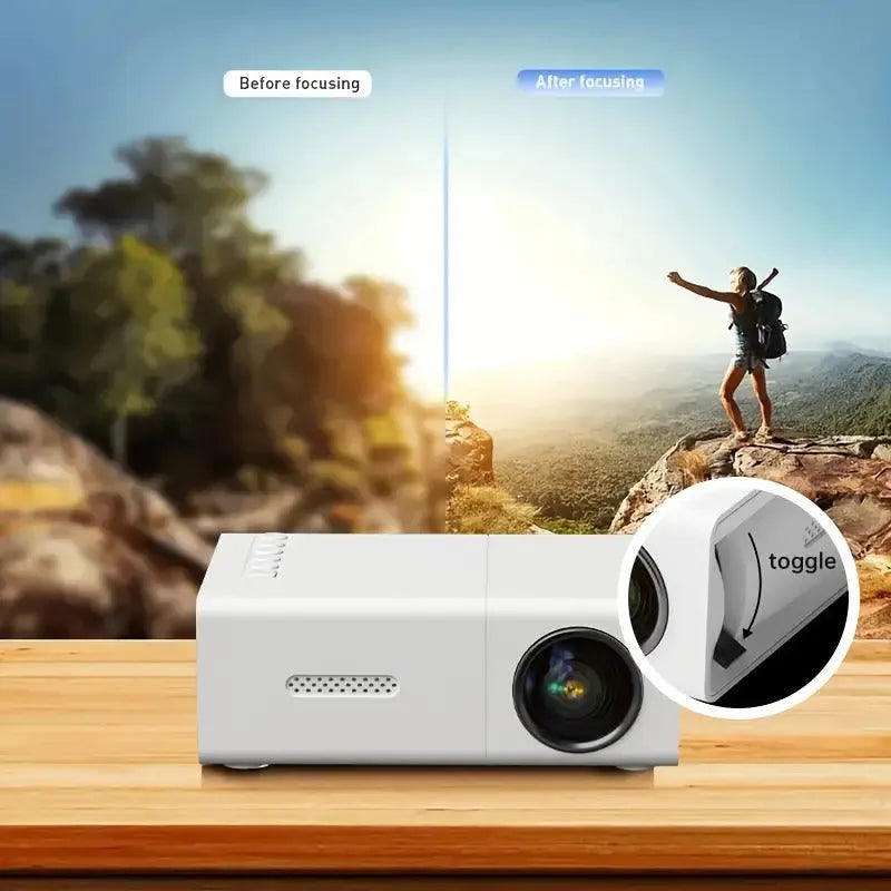 White and black M100 portable LED mini projector with remote control on a table.