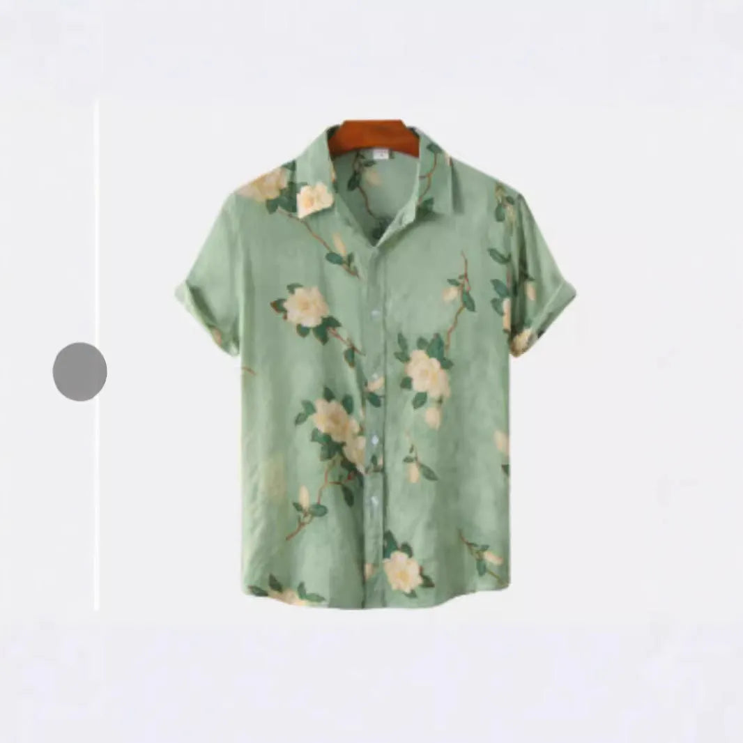 A man wearing a short sleeve floral print Hawaiian shirt with a button-up front and lapel collar.