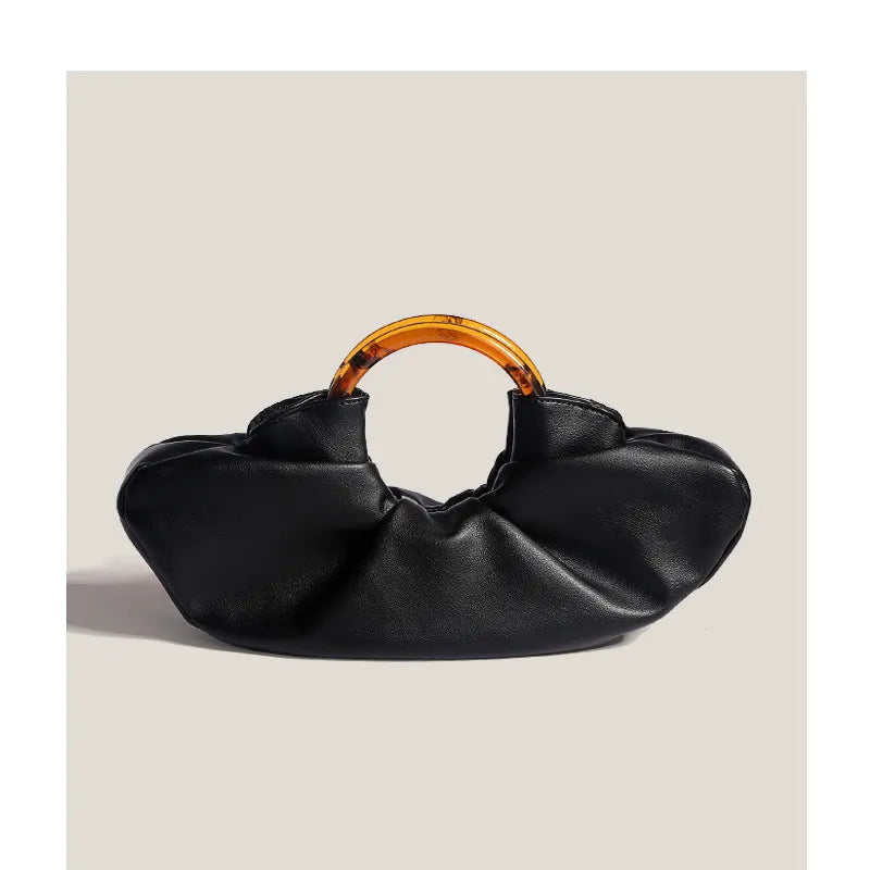 Niche Horn Bag acrylic ring handbag in black PU leather with fold design detail