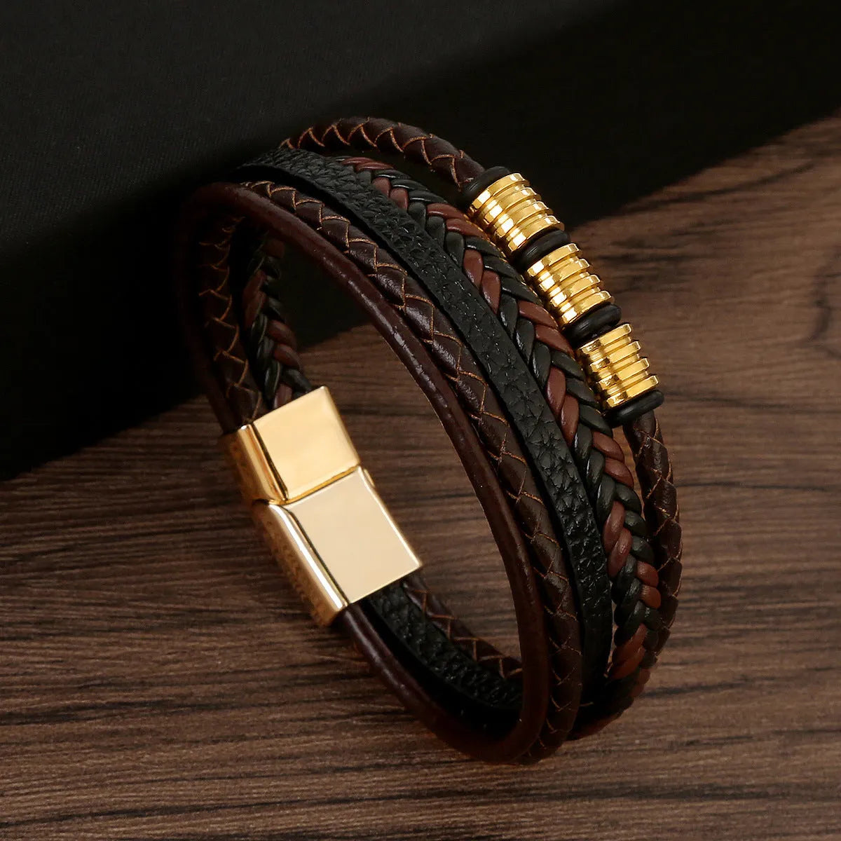 Men's woven leather bracelet with alloy magnetic buckle, geometric design, electroplated finish, in black or brown.