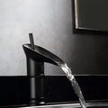 Wine glass shaped brass basin mixer tap in a choice of black, gold or silver finishes.