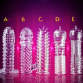Crystal Exotic transparent soft rubber condom sleeve in dragon scale style on plain background
