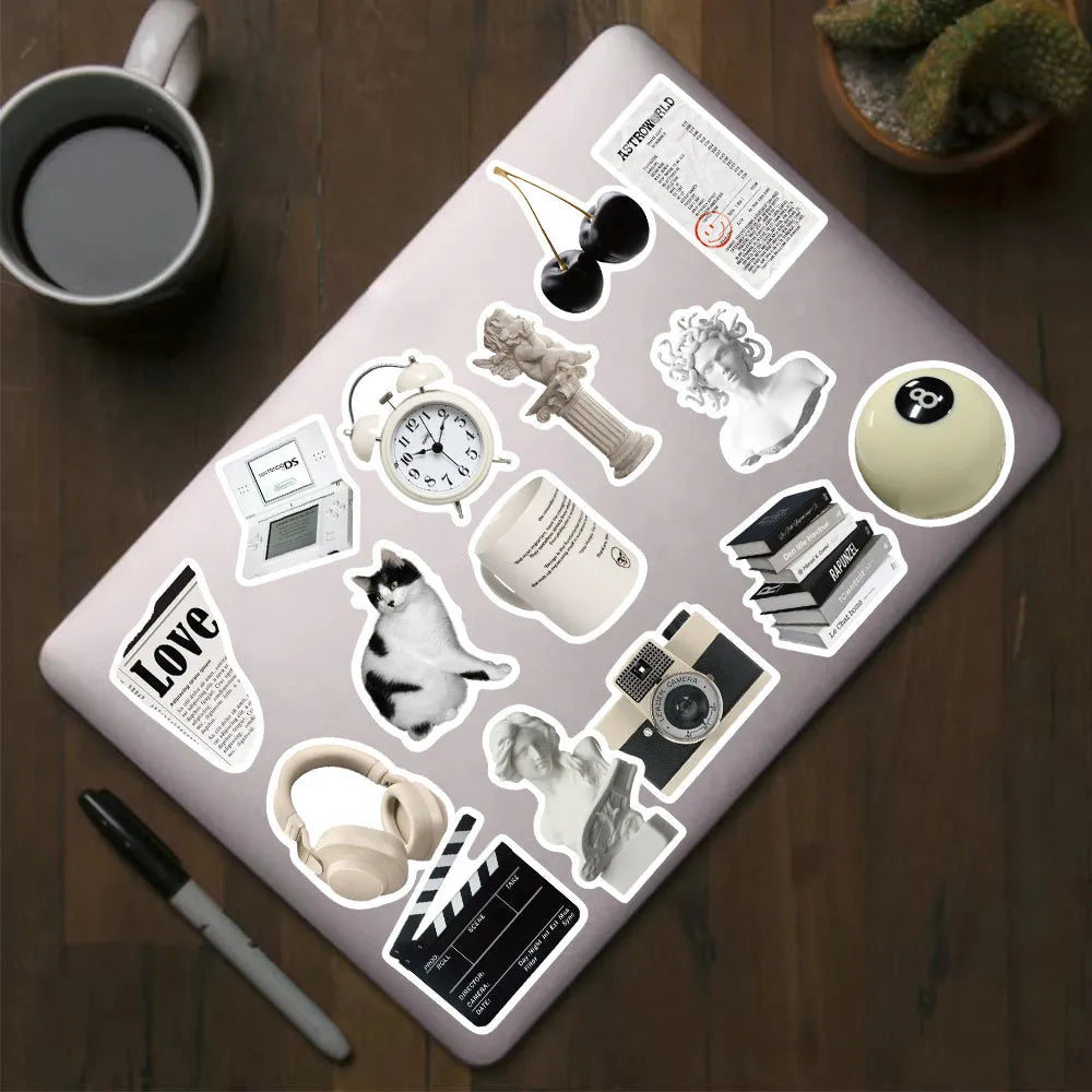 61-piece pack of black and white PVC waterproof decorative stickers laid flat.