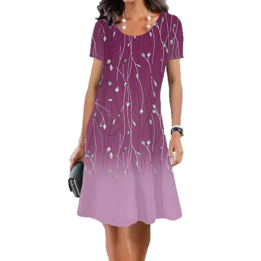 A woman's mid-length floral print summer dress with short sleeves and a round neck, shown in Element 3 colour.