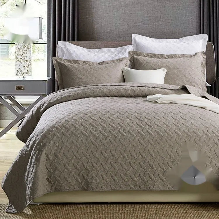 Double-sided pure cotton bed cover three-piece set in a light grey damascus pattern on a bed.