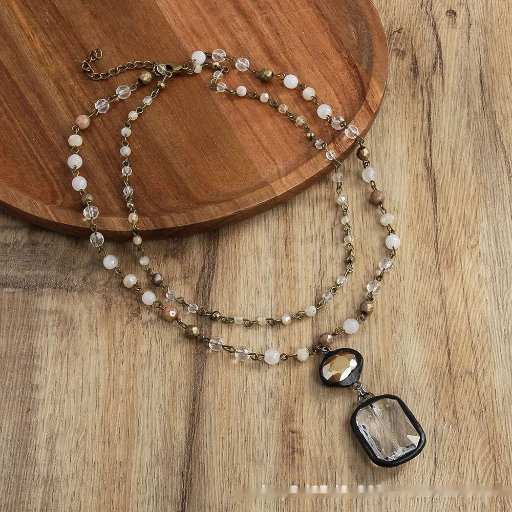 Tribal style two-layer necklace with glass pendant and semi-precious stones on adjustable chain