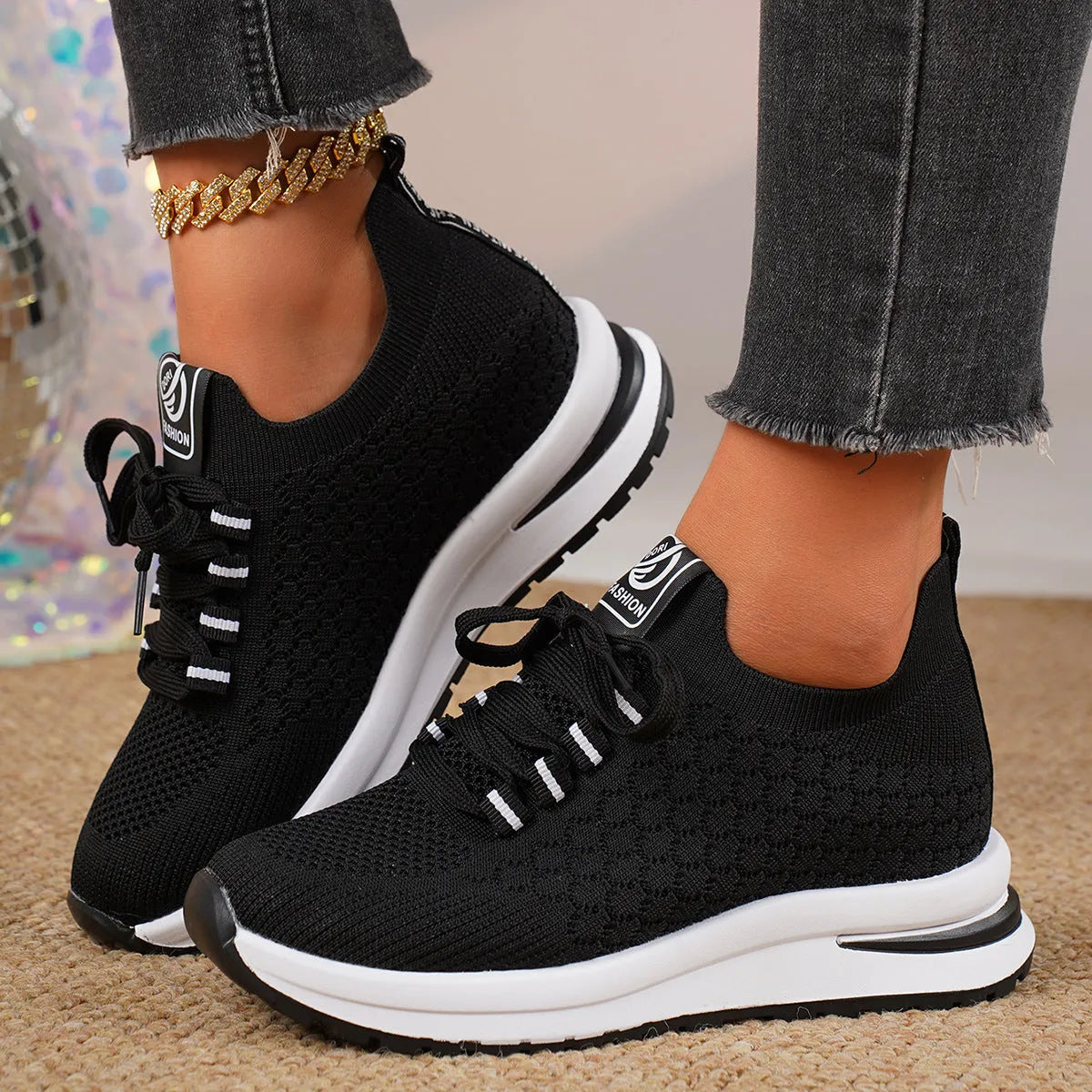Women's black platform flat pumps with mesh upper and lace-up design on rubber sole