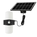 Black solar-powered outdoor floodlight with motion sensor and abstract design