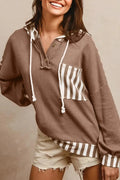 Straw yellow hoodie with waffle texture, striped patchwork, a button neck, and a drawstring hood.