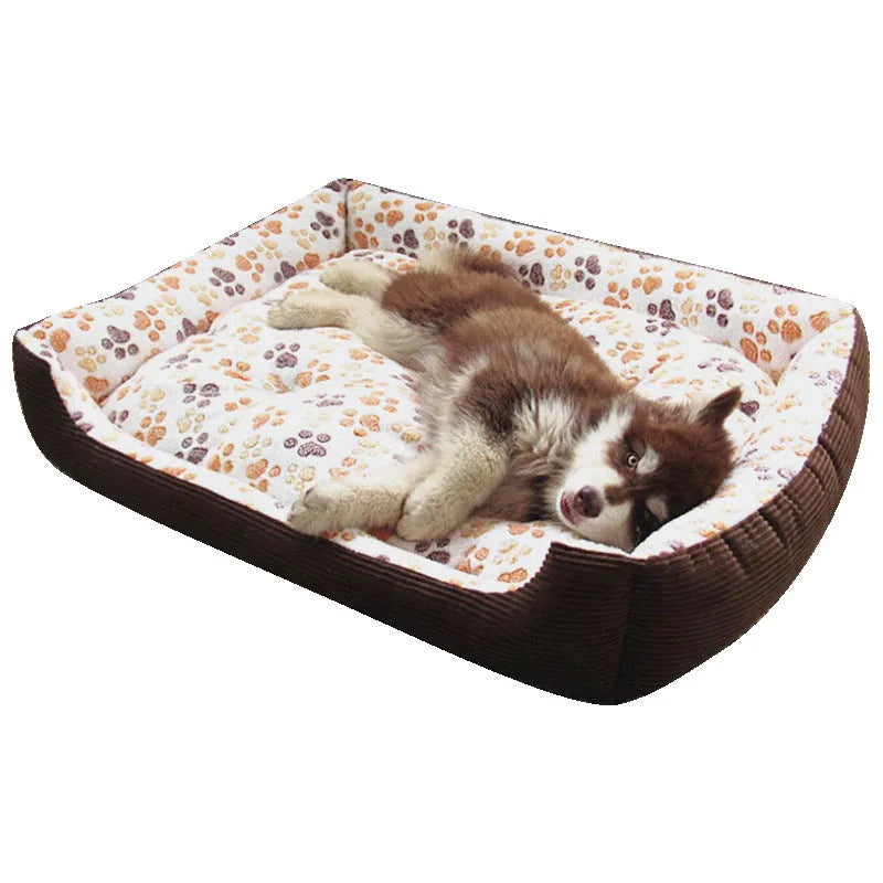 Beige sofa-style dog bed with plush fabric and raised bolsters for small dogs