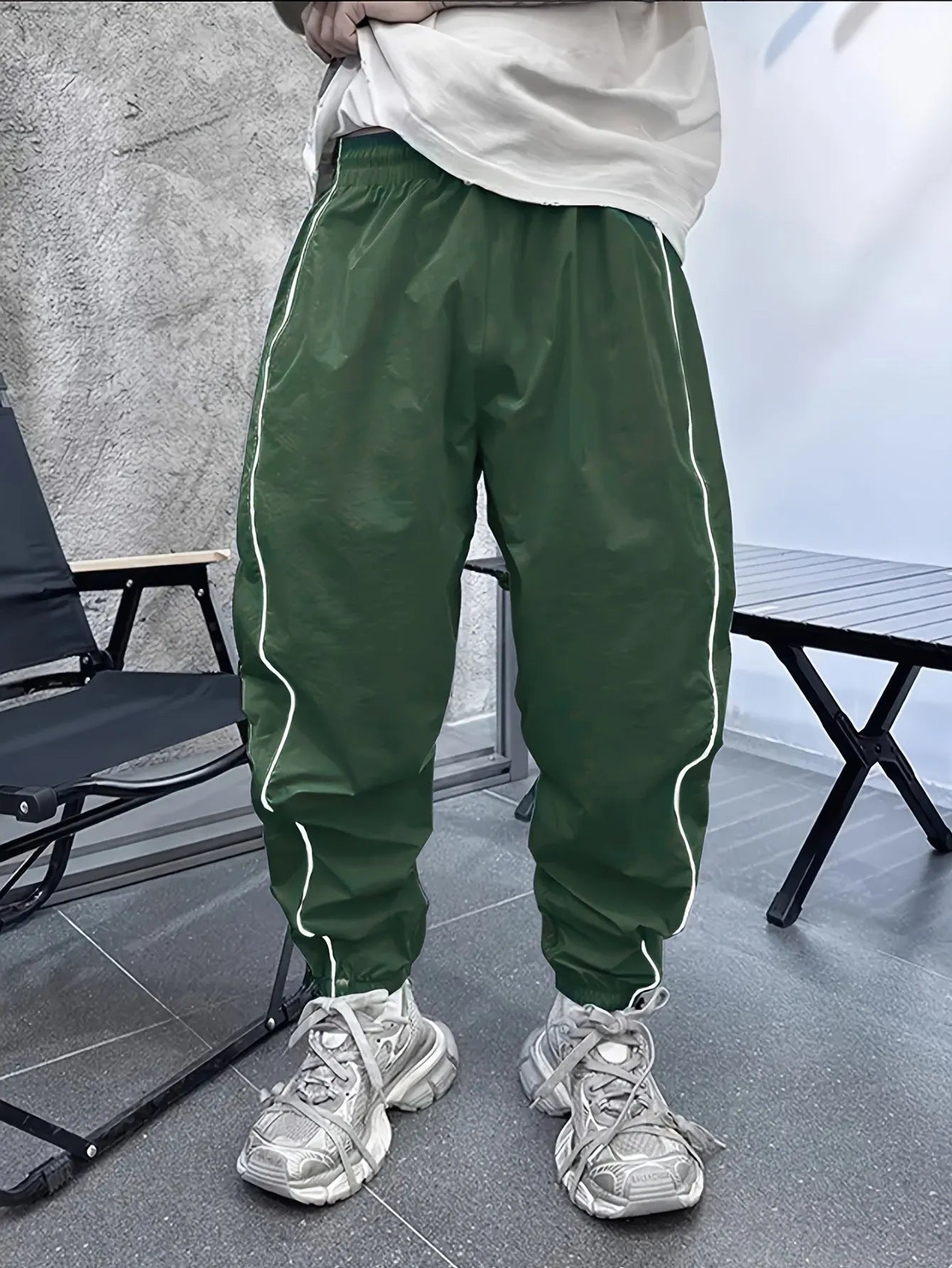 Men's loose fit cropped casual trousers in bamboo fibre, shown in army green colour.