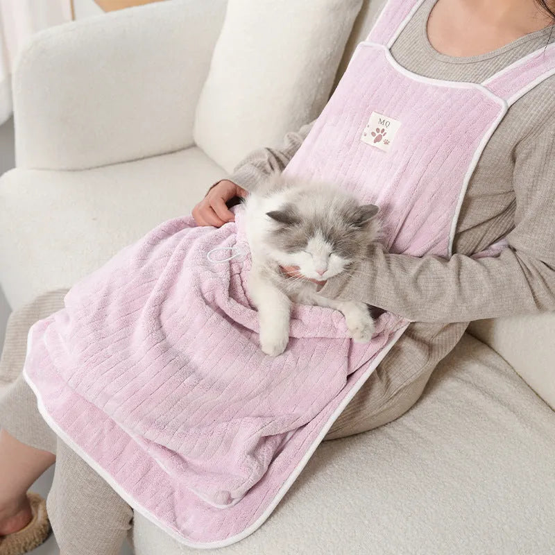 Cloth cat petting apron in a striped pattern, shown worn by a person holding a cat.