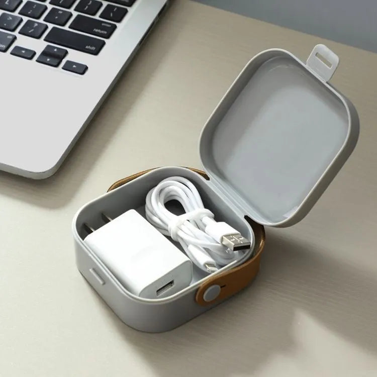 Medium solid-colour polypropylene storage box with lid for cables and headphones.