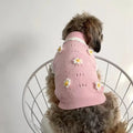 Green floral pet sweater for a small dog, showing the stretch knit material and blossom pattern.