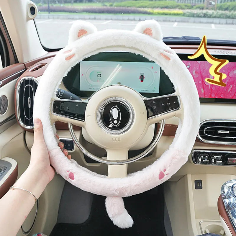 Plush rabbit fur style steering wheel cover with embroidered panda design, fitted on a car wheel