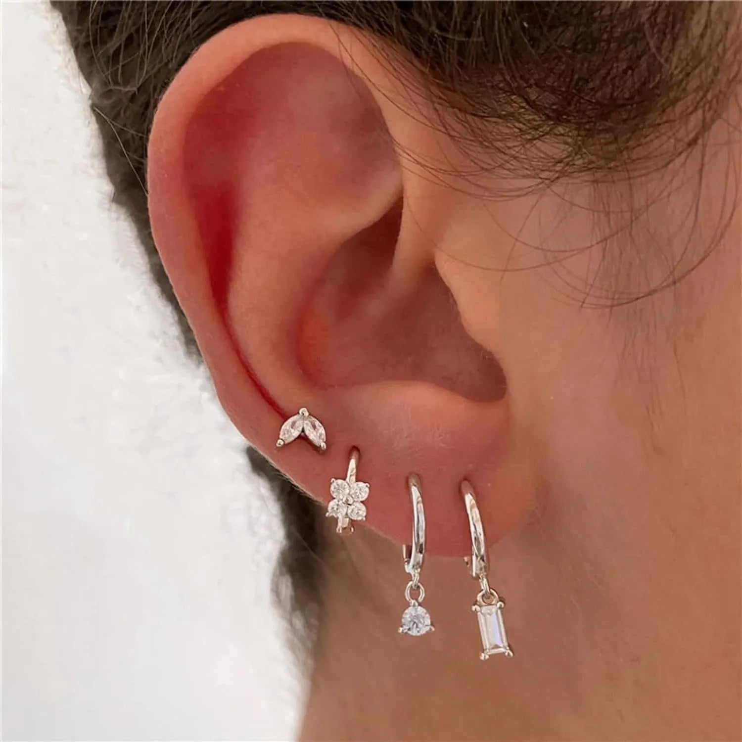 Copper geometric earrings set with star, ellipse, ring and quadrilateral designs in gold or silver finish
