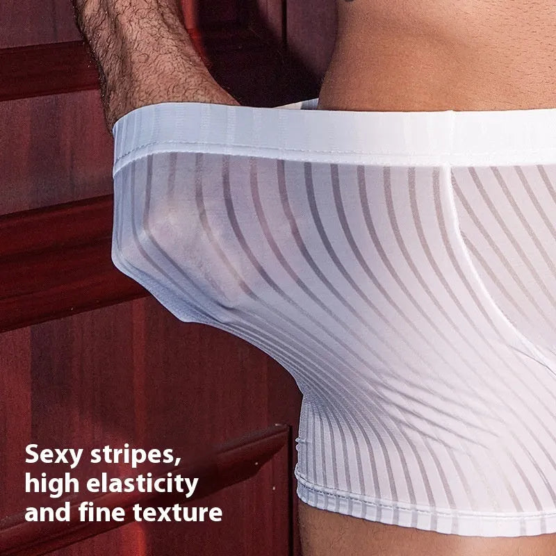 Men's black vertical stripe boxer briefs made from nylon fabric on a grey background