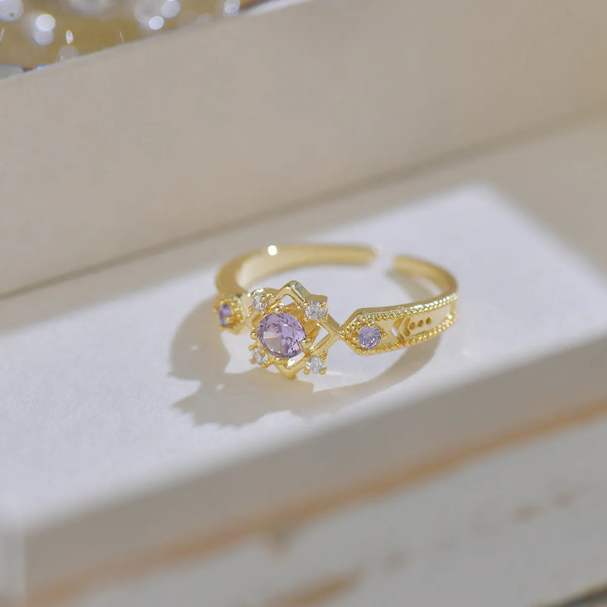 Geometric French style women's ring with purple zircon stones and open mouth adjustable design.