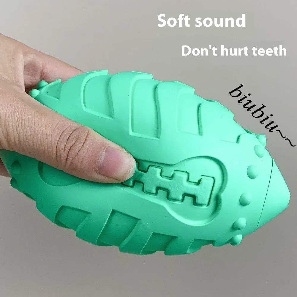 Sapphire blue rubber dog training ball with rugby shape for interactive play and teeth cleaning
