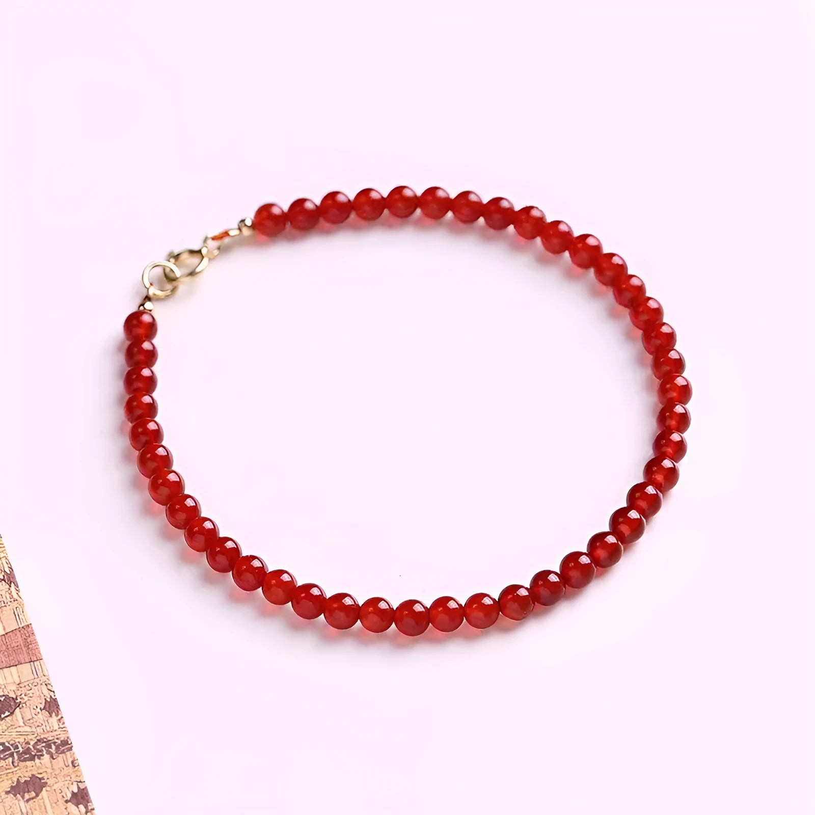 Ultra-thin classic red agate bracelet for women on a white background.