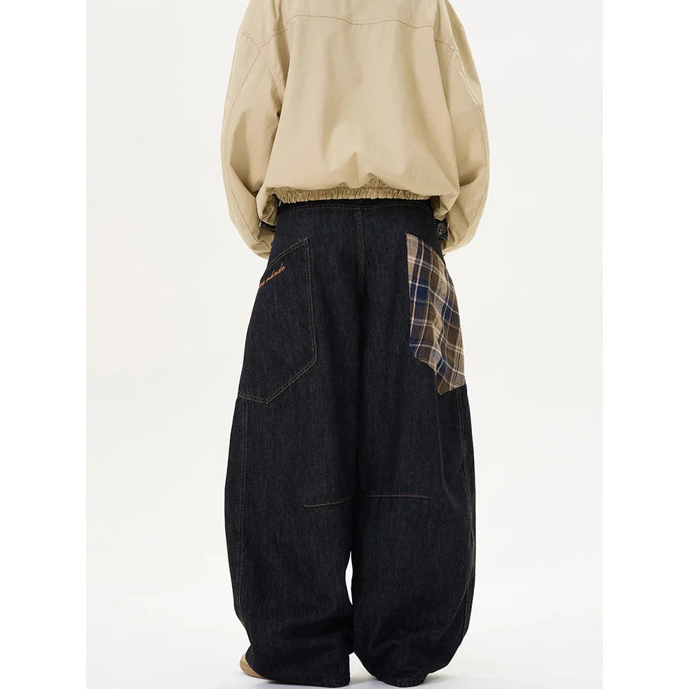 Loose straight-leg cotton trousers in a red plaid pattern, showing mid waist and casual fit.