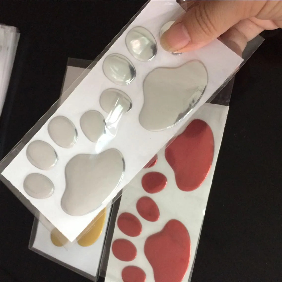 PVC car sticker with hand-shaped brush design showing dog footprints for bumper scratch concealment