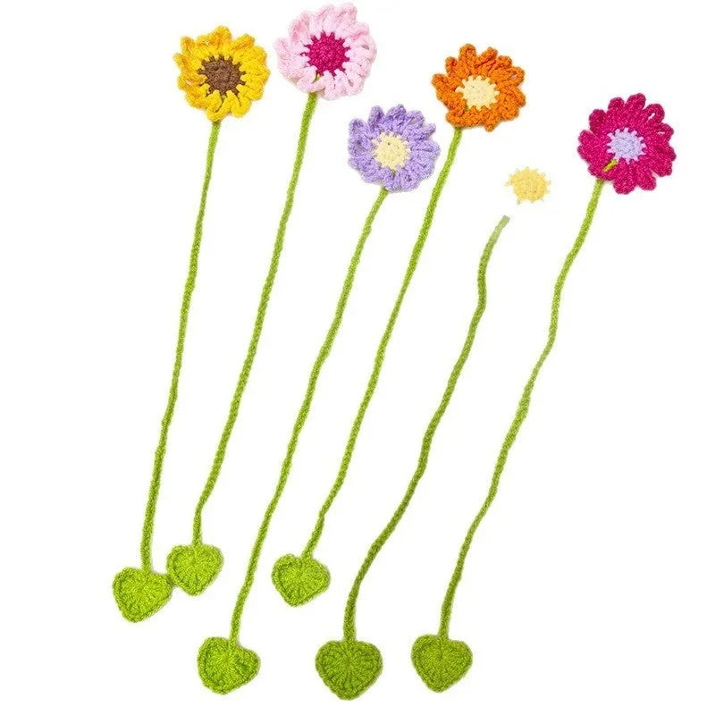 Hand-crocheted daisy bookmark with flexible wire in yellow, showing texture and charm detail.