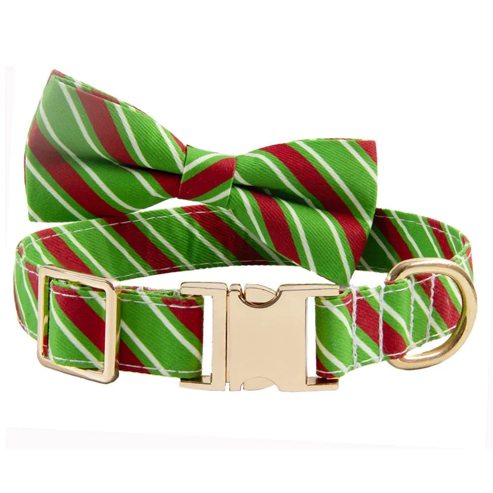 Striped green dog collar with adjustable buckle and a matching bow, showing custom engraving space.
