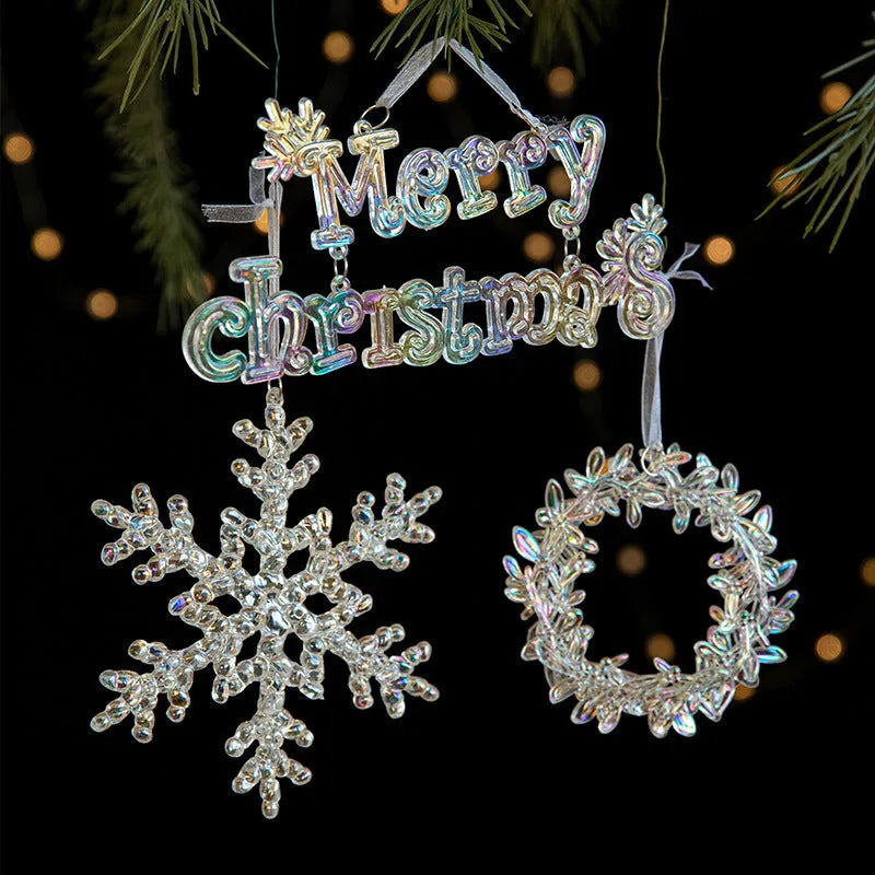Transparent acrylic and plastic Christmas hanging decorations in snowflake, elk, icicle, and garland designs.
