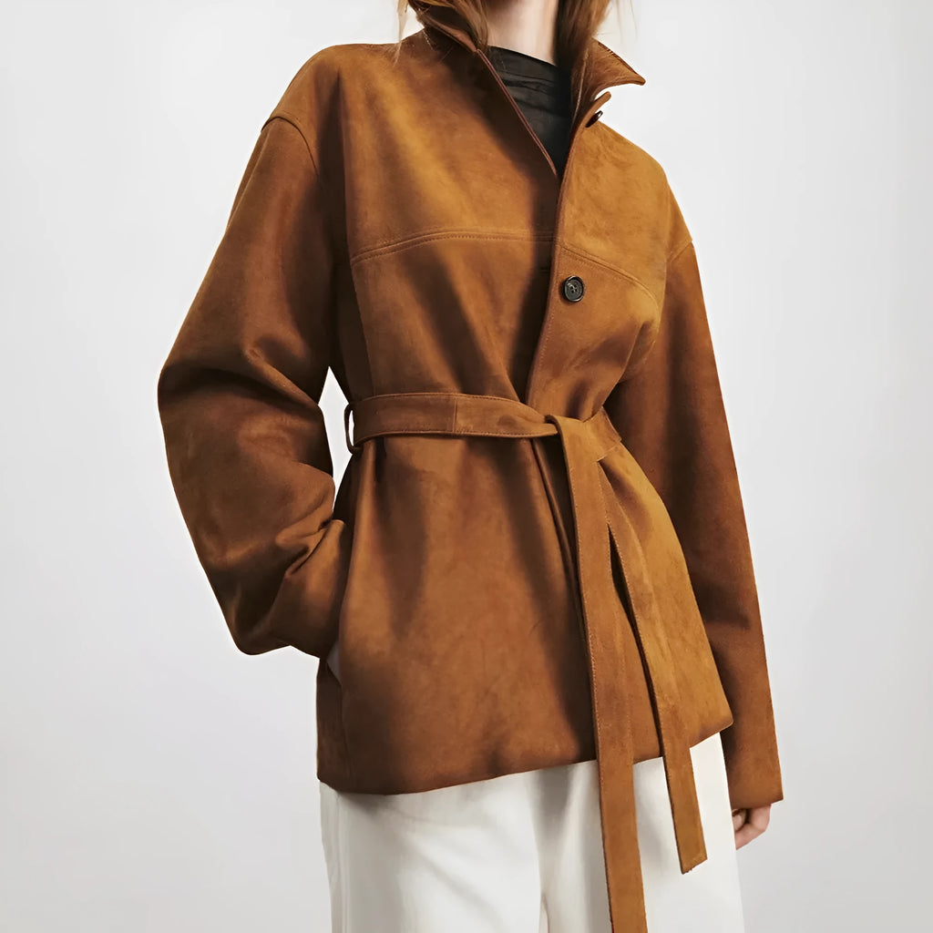 Yellow Brown retro cashmere coat with Peter Pan collar and leather stitching on a hanger.