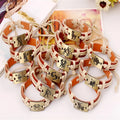 12 constellation alloy bracelet set with copper leather and braided hemp rope on a neutral background