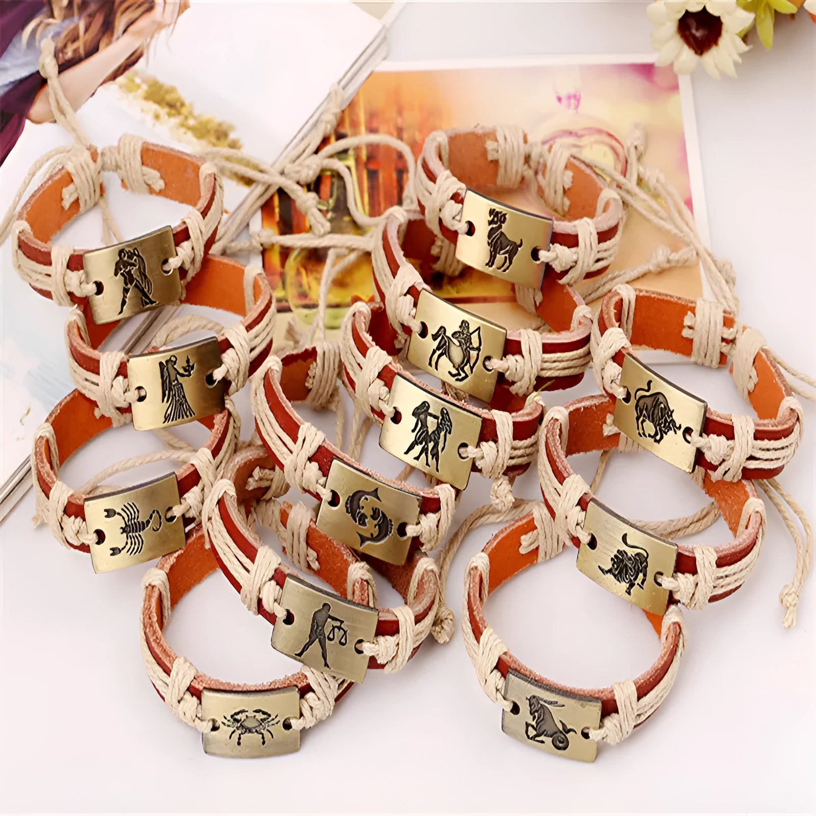 12 constellation alloy bracelet set with copper leather and braided hemp rope on a neutral background