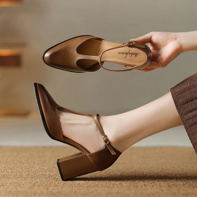Women's pink and dark brown retro Mary Jane shoes with a pointed toe, buckle, and hollow design detail.
