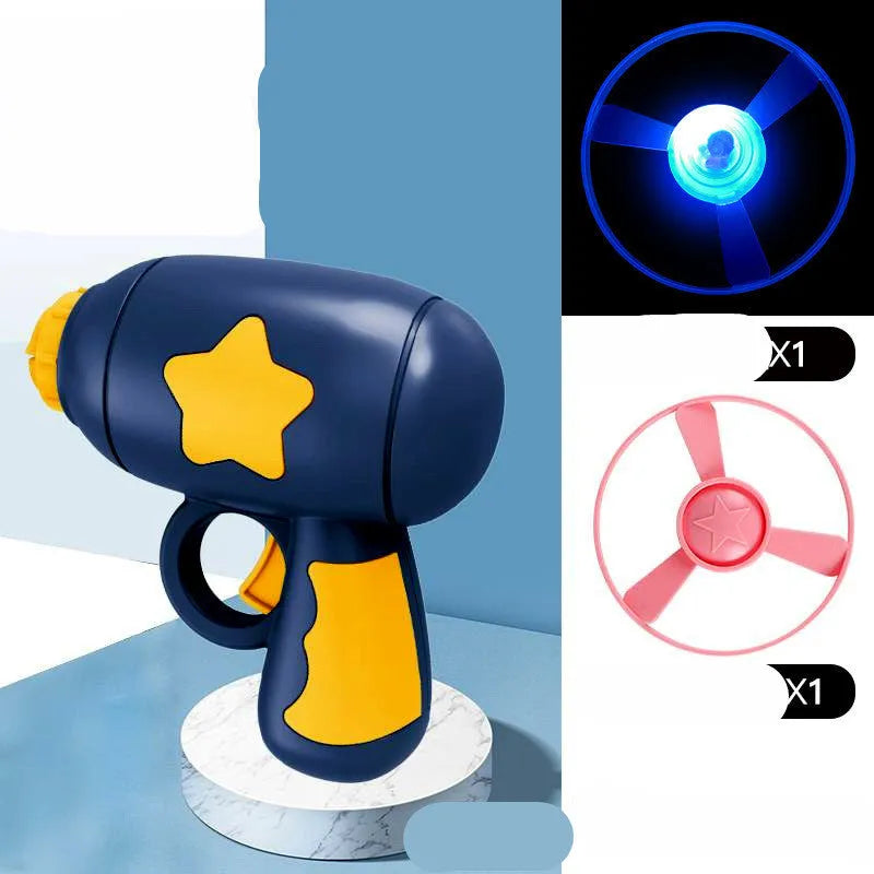 Blue and yellow LED light-up flying saucer launcher toy set with plastic gun and three discs.
