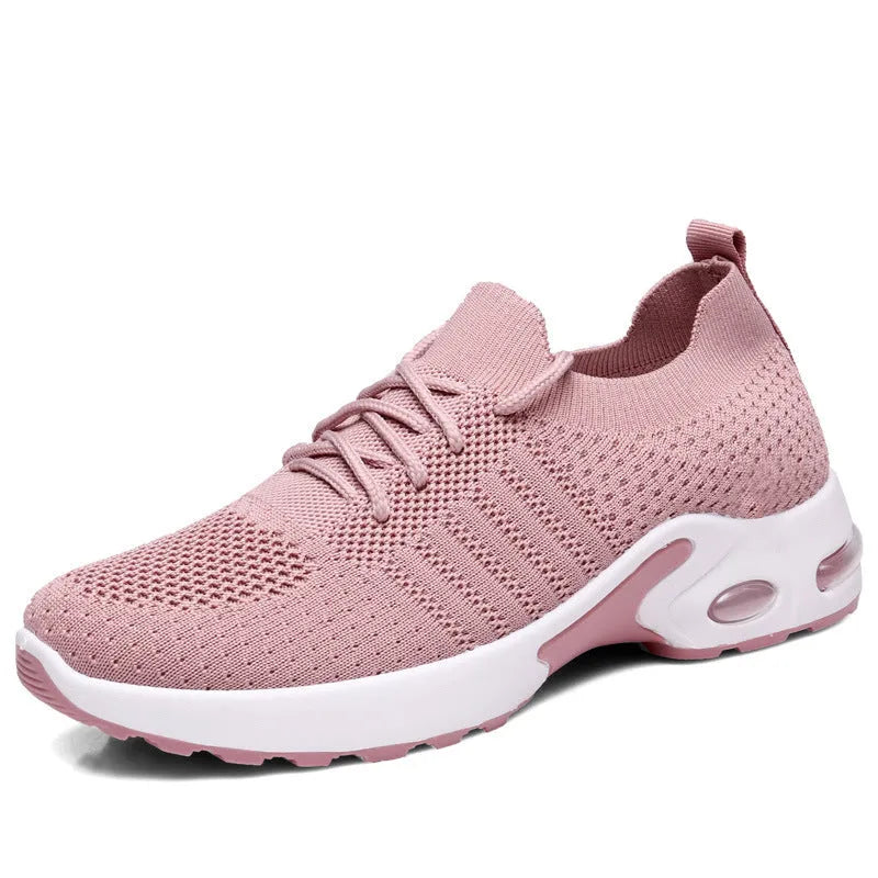 Women's black mesh lace-up sneakers with round toe and non-slip PVC sole on a white background.