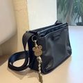 Retro-style small square crossbody bag in Oxford cloth for unisex casual and travel use