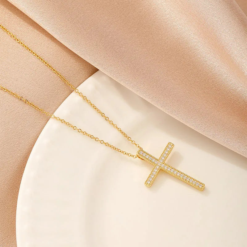 Women's electroplated copper necklace showing four pendant options: heart, butterfly, cross and round diamond designs