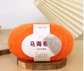 A 200g ball of mohair Inverness thread in a chosen colour, next to a measuring tape showing 180cm for the finished scarf length.