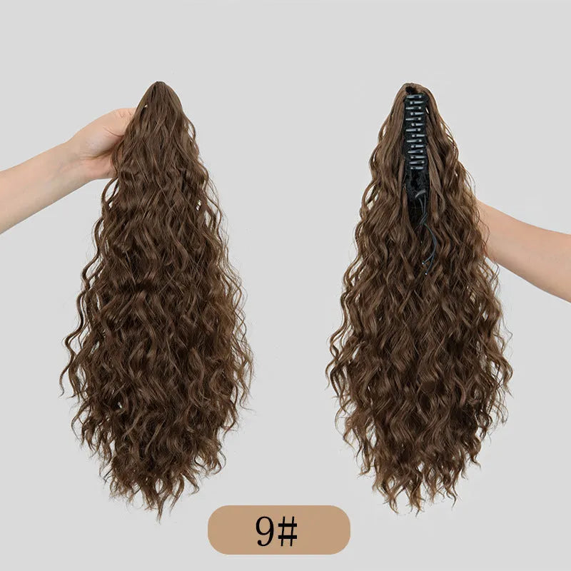 Synthetic corn curler wig with a textured water ripple grip ponytail, shown in a shade from the available colour range.