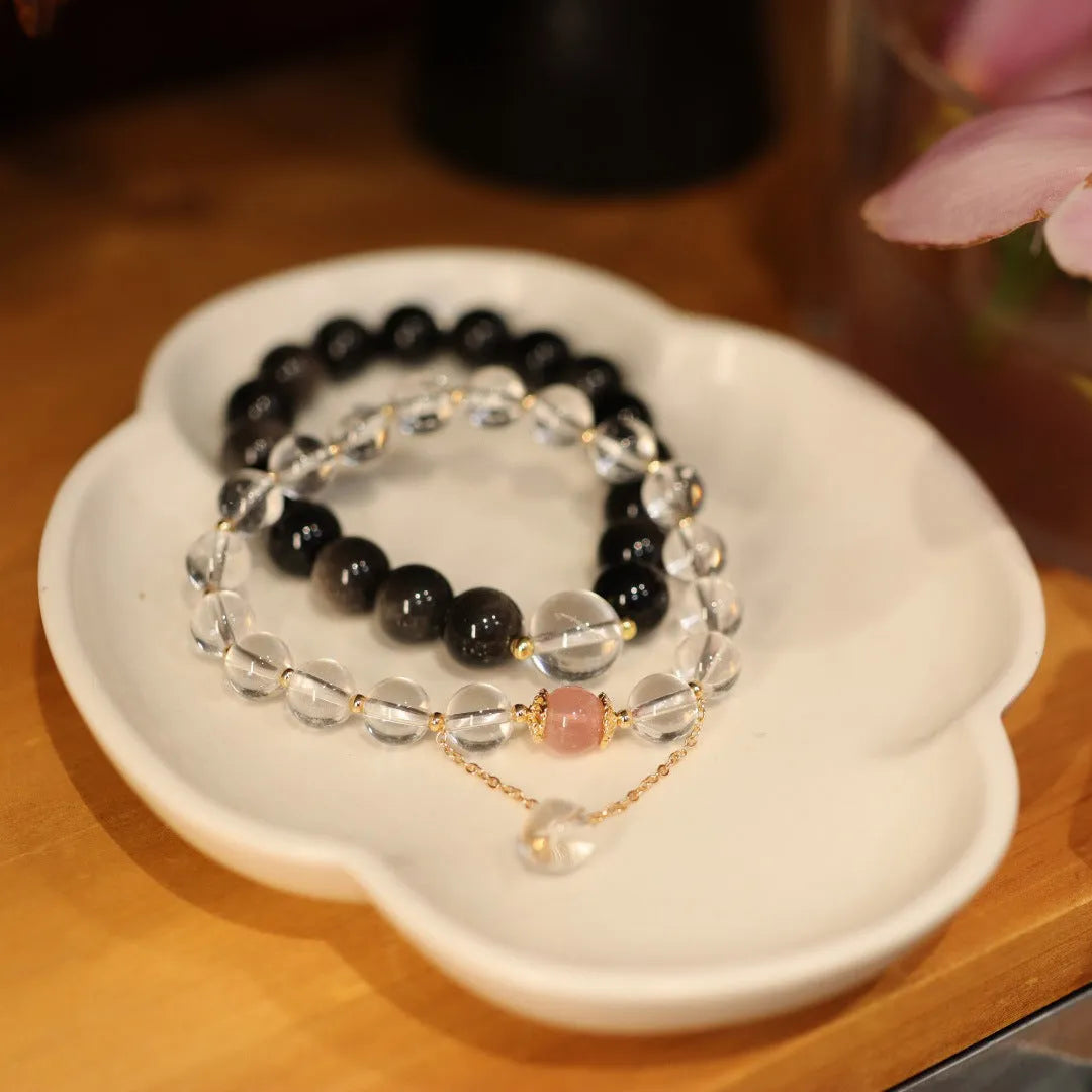 White and pink cat eye obsidian crystal bracelet with geometric Chinese patterns