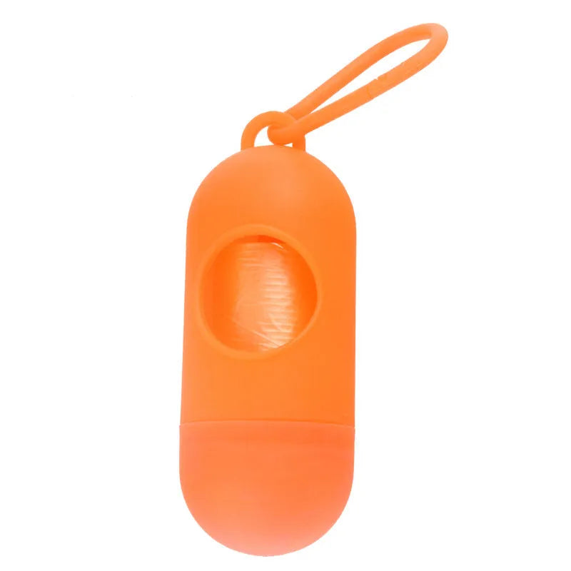 Black dog waste bag holder with Velcro strap and metal hook, showing bag dispenser slot.