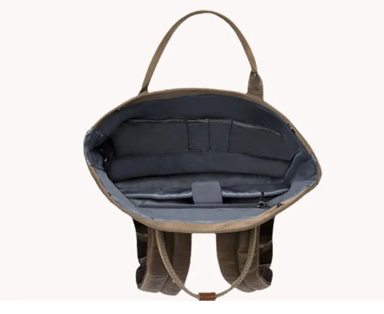 Casual polyester daypack in black showing cover opening and internal laptop pocket.