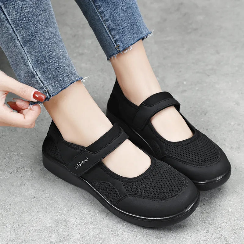 Women's grey mesh slip-on casual shoes with Velcro fastening and flat polyurethane sole