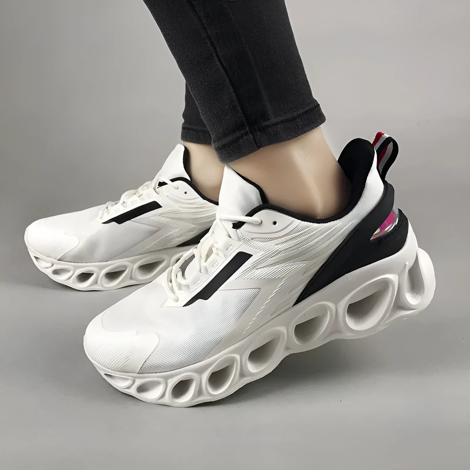 Men's low-top casual sports shoes in black with mesh upper and lace-up front.