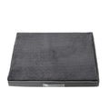 Removable washable memory sponge dog mat in khaki colour on a wooden floor.