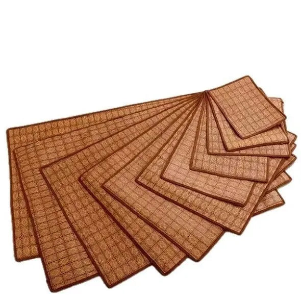 Brown rattan fibre dog cooling mat resting on a floor.