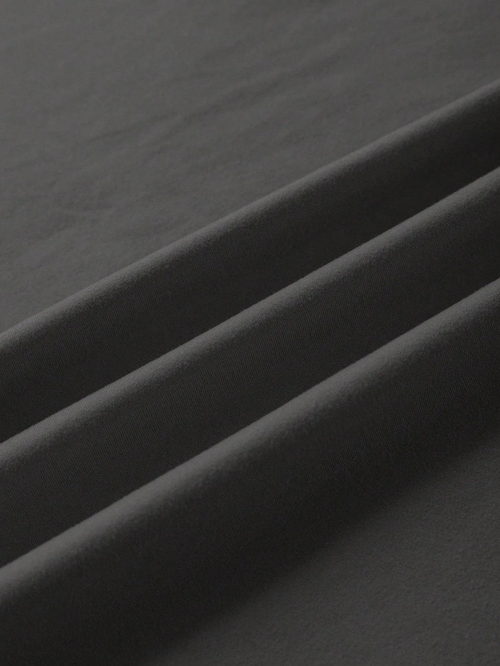 A loose, straight-cut cotton T-shirt for men and women in various colours.